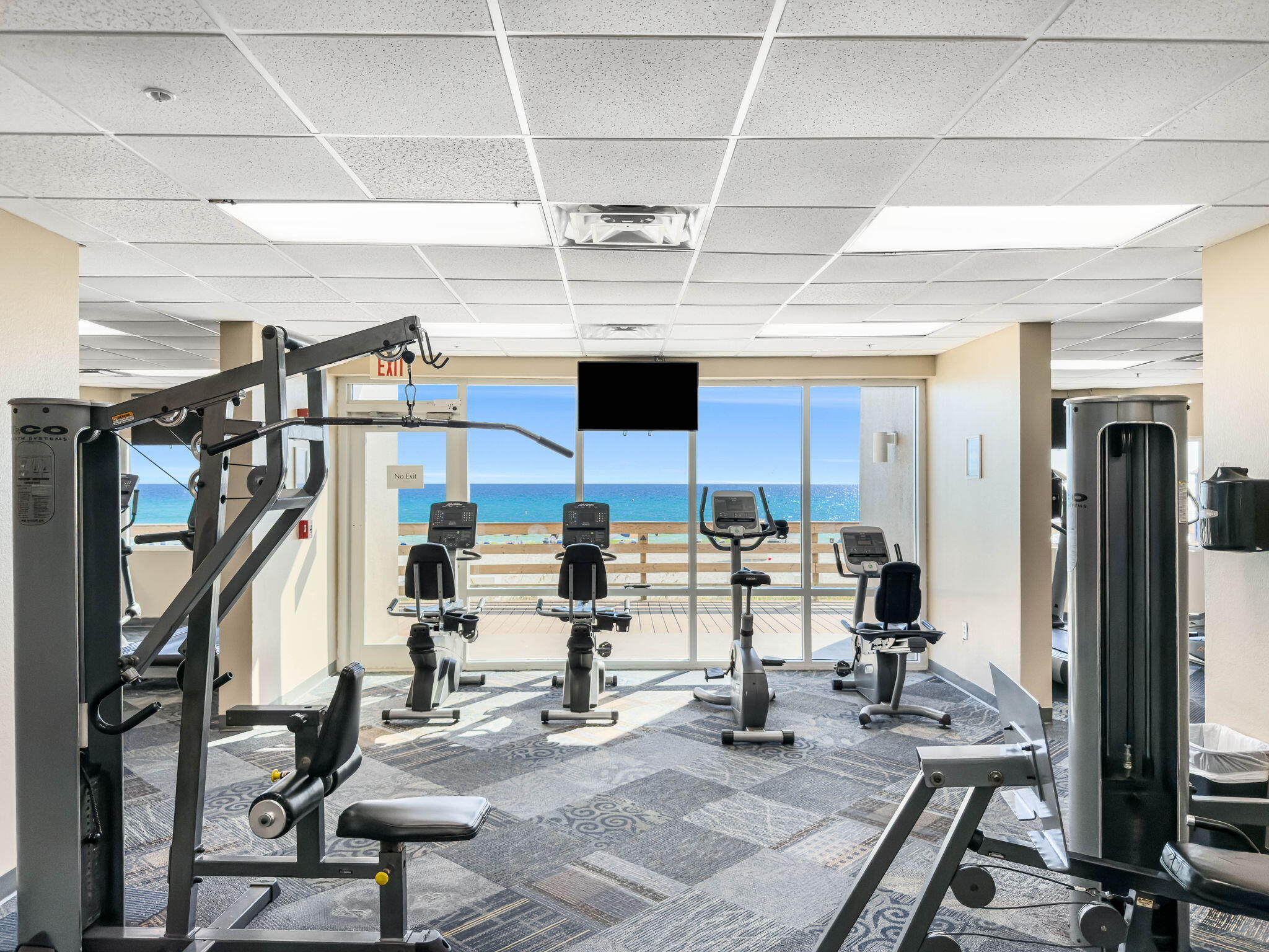 16819 Front Beach Road, Unit 405 Panama City Beach, FL 32413 - Photo 42 of 48 a view of gym equipment and children