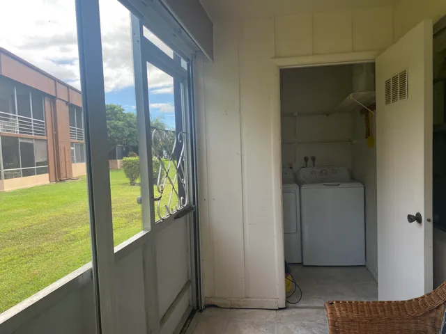 a living room with lots of furniture and a chandelier
