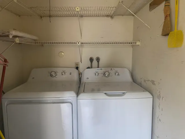 a living room with furniture and a pool table