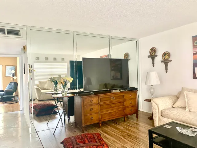 a living room with furniture and a rug
