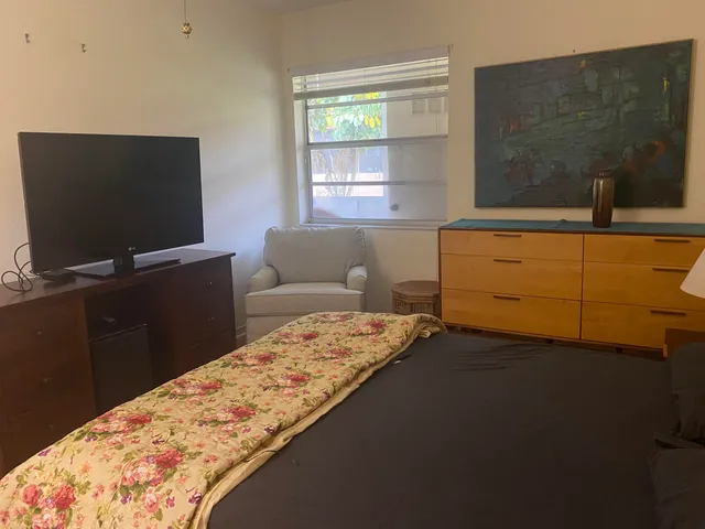 a living room with a couch and a large window