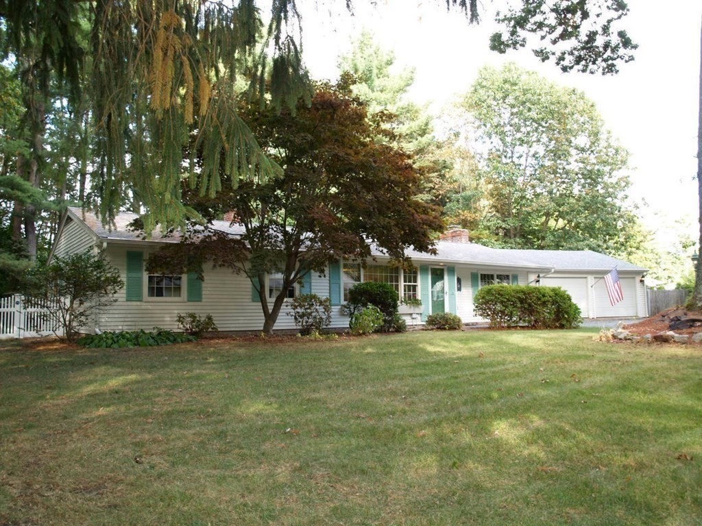 15 Clarissa Road Chelmsford, MA 01824 - Photo 20 of 22 a view of a yard in front of a house with a large tree