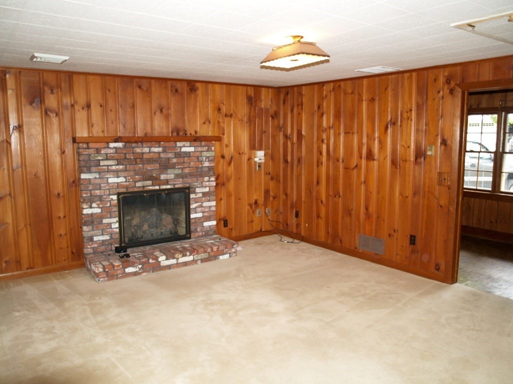 15 Clarissa Road Chelmsford, MA 01824 - Photo 6 of 22 a view of an empty room with a fireplace