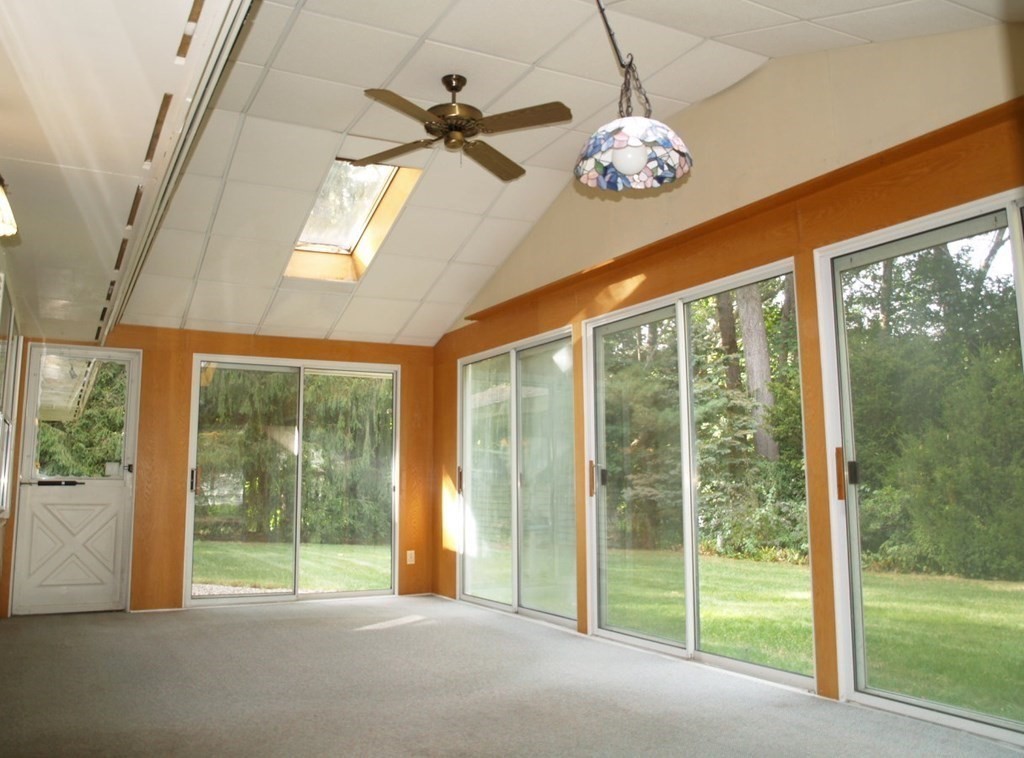 15 Clarissa Road Chelmsford, MA 01824 - Photo 8 of 22 a living room with a large window and chandelier