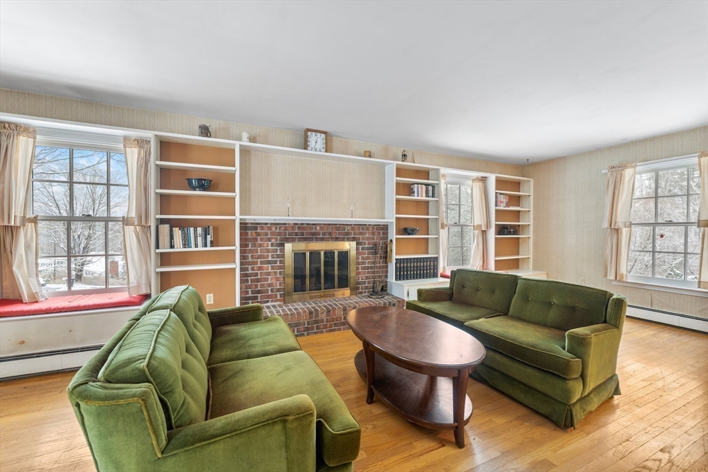 15 Country Hill Road Sturbridge, MA 01566 - Photo 12 of 41 a living room with furniture and a fireplace