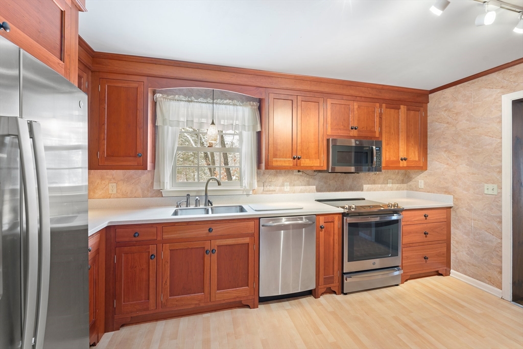 15 Country Hill Road Sturbridge, MA 01566 - Photo 2 of 41 a kitchen with stainless steel appliances granite countertop a sink stove and refrigerator