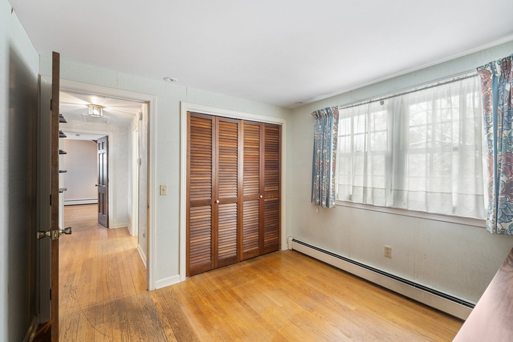 15 Country Hill Road Sturbridge, MA 01566 - Photo 23 of 41 wooden floor in an empty room with a window