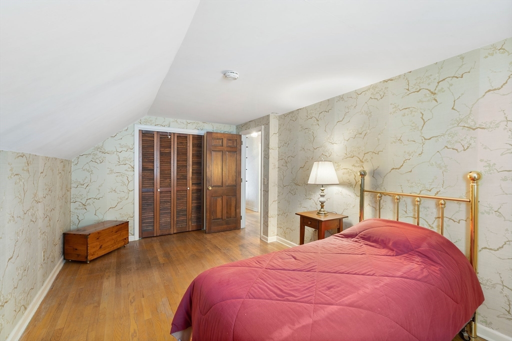 15 Country Hill Road Sturbridge, MA 01566 - Photo 25 of 41 a bedroom with a bed and a view of bathroom