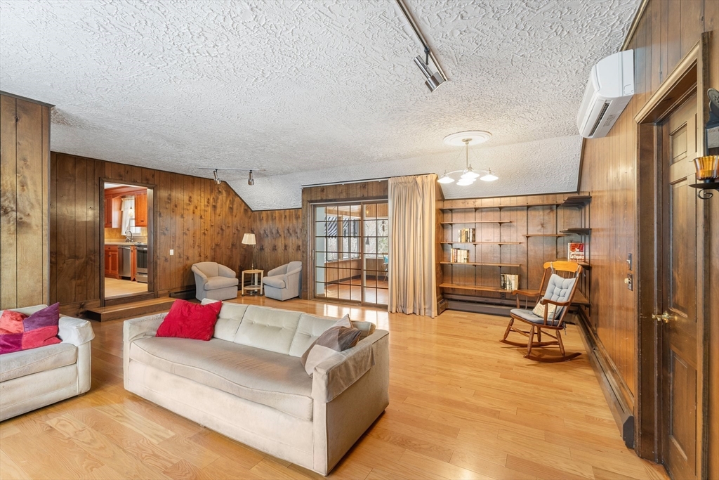 15 Country Hill Road Sturbridge, MA 01566 - Photo 7 of 41 a living room with furniture gym equipment and a large window