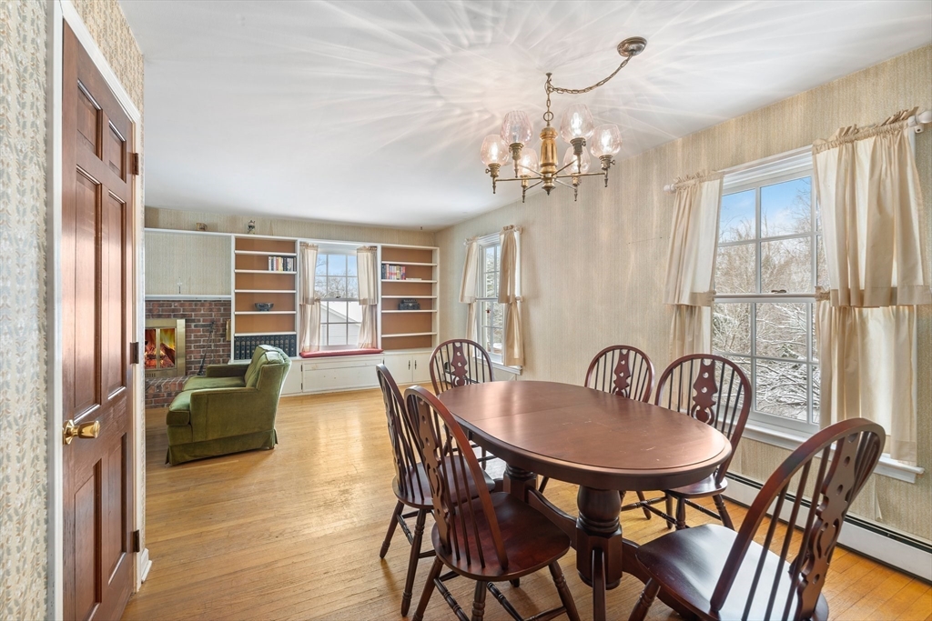 15 Country Hill Road Sturbridge, MA 01566 - Photo 10 of 41 a dining room with furniture a chandelier and wooden floor