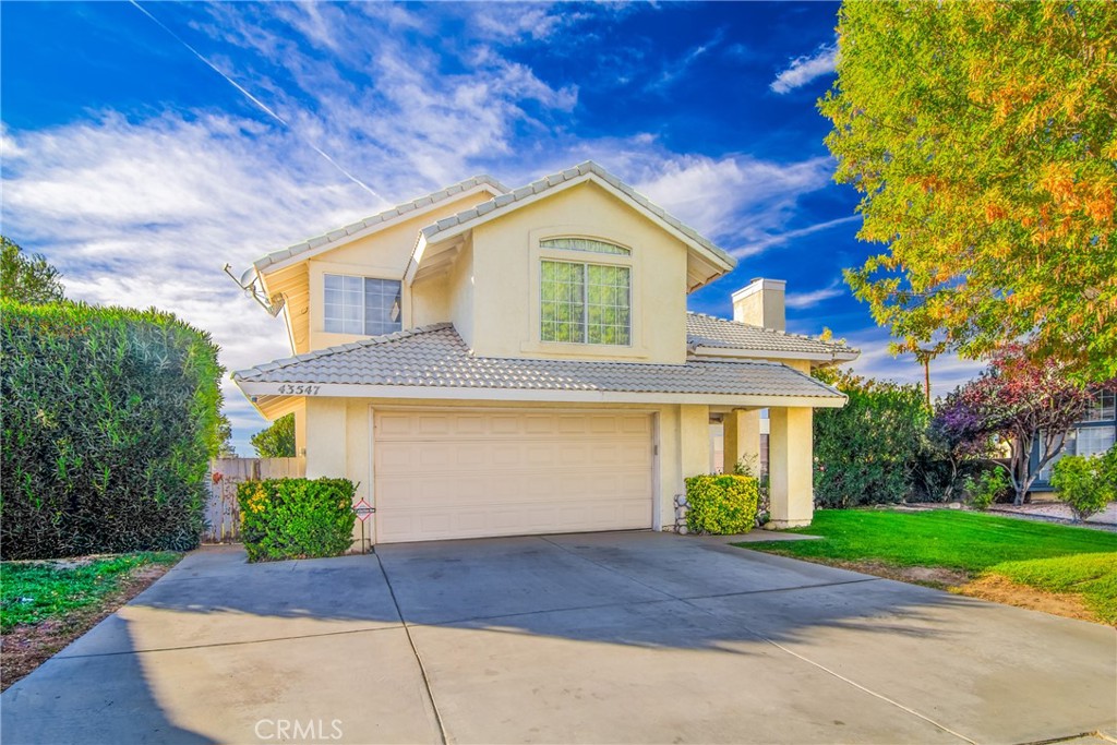 43547 Carpenter Drive Lancaster, CA 93535 - Photo 1 of 1 a front view of a house with a yard and garage