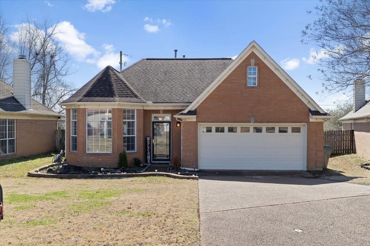 8621 High Cotton Cove Cordova, TN 38018 - Photo 1 of 22 a front view of a house with a yard