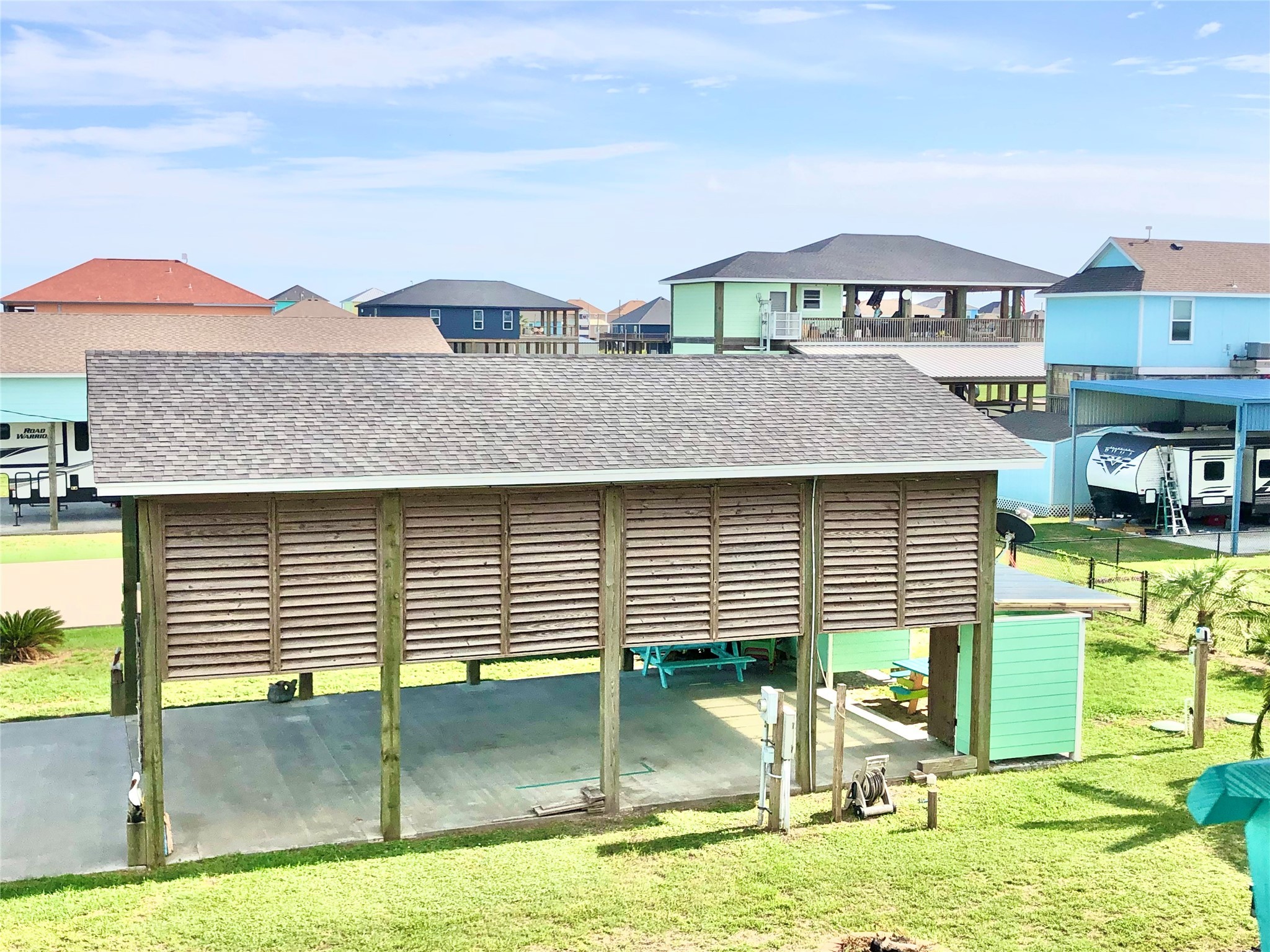 911 E Road Crystal Beach, TX 77650 - Photo 14 of 18 a view of a house with a swimming pool