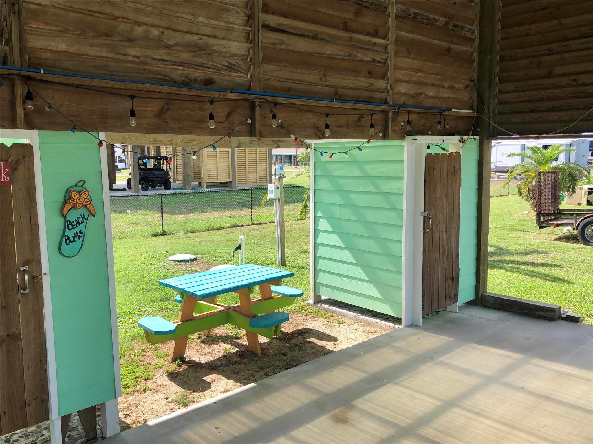 911 E Road Crystal Beach, TX 77650 - Photo 10 of 18 a room with lots of wooden furniture and a shower