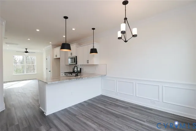 a view of a kitchen with wooden floor