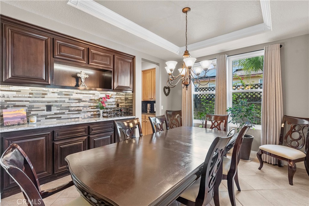 28834 Rock Canyon Drive Saugus, CA 91390 - Photo 13 of 58 a dining room filled chandelier and wooden floor