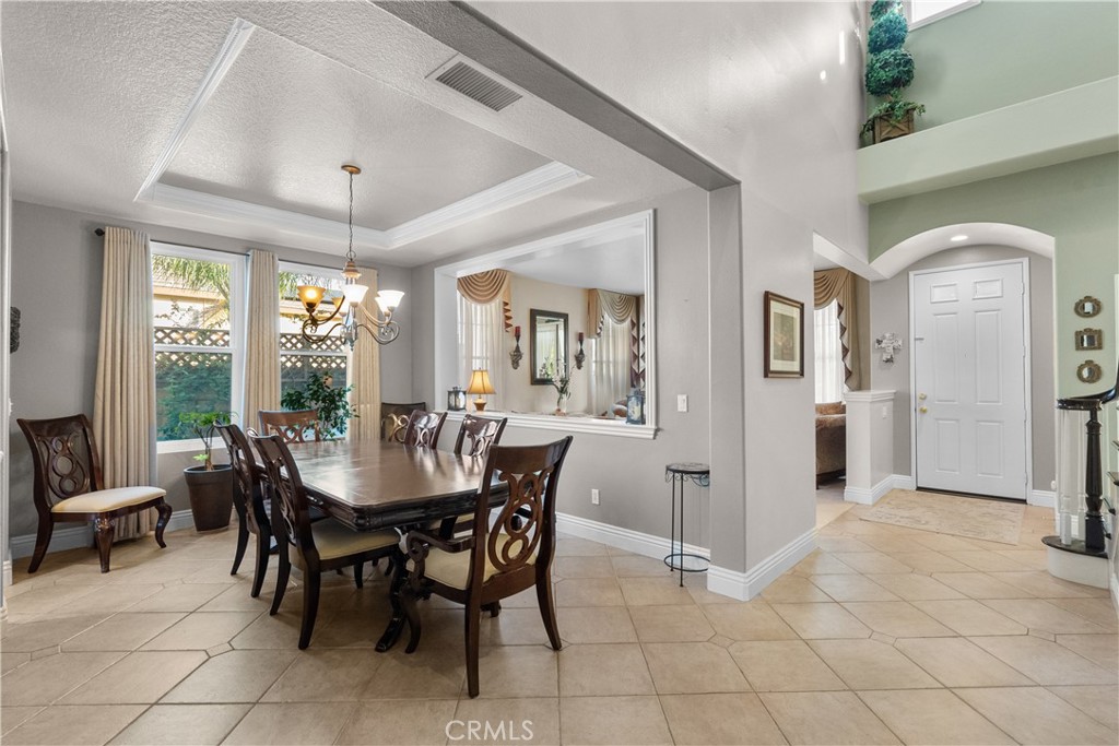 28834 Rock Canyon Drive Saugus, CA 91390 - Photo 14 of 58 a view of a dining room with furniture and chandelier