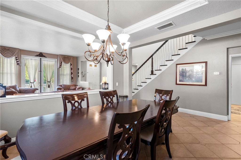 28834 Rock Canyon Drive Saugus, CA 91390 - Photo 15 of 58 a view of a dining room with furniture and chandelier