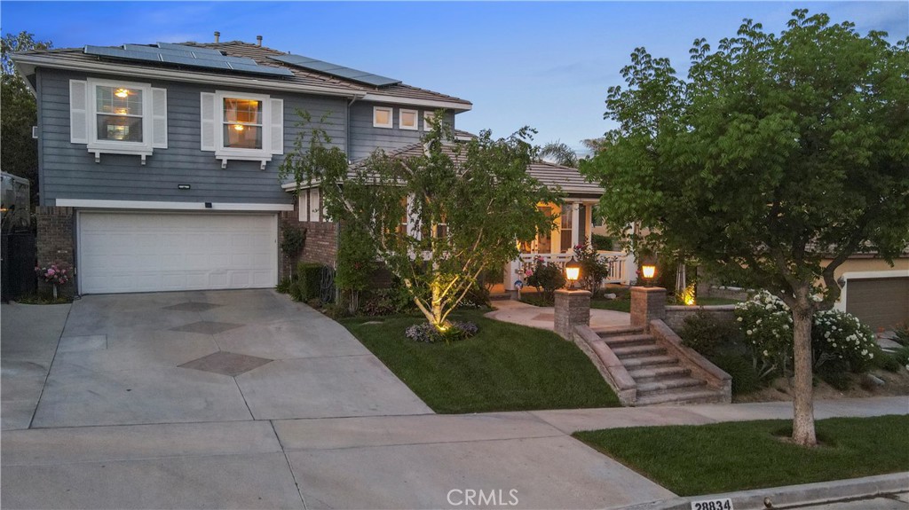 28834 Rock Canyon Drive Saugus, CA 91390 - Photo 20 of 58 a front view of a house with a yard