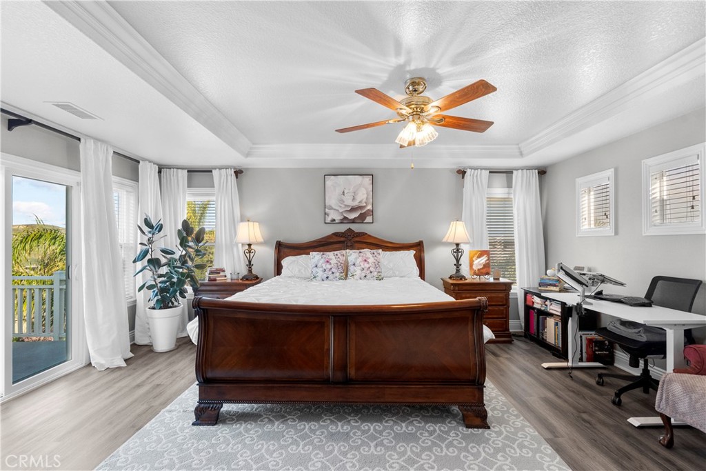 28834 Rock Canyon Drive Saugus, CA 91390 - Photo 31 of 58 a bedroom with a bed and a chandelier