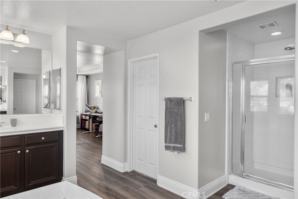 28834 Rock Canyon Drive Saugus, CA 91390 - Photo 35 of 58 a spacious bathroom with a shower and a sink