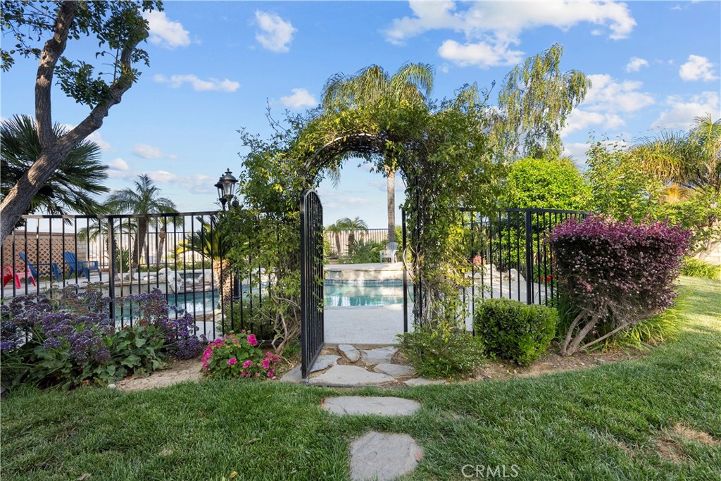 28834 Rock Canyon Drive Saugus, CA 91390 - Photo 51 of 58 a front view of a house with a yard and potted plants