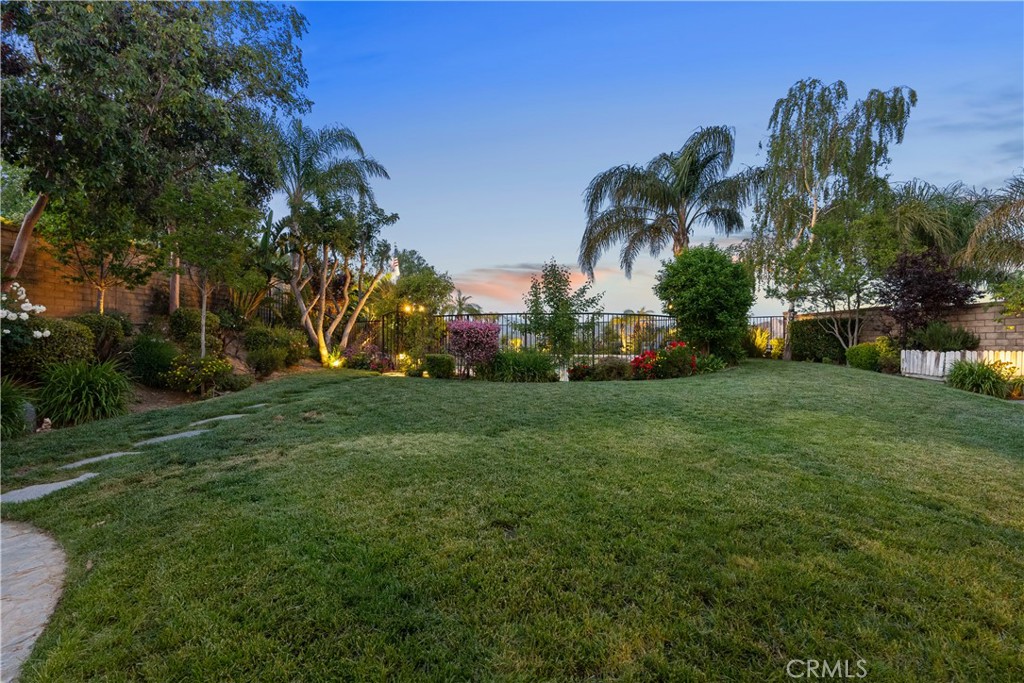 28834 Rock Canyon Drive Saugus, CA 91390 - Photo 55 of 58 a view of a garden with a building in the background