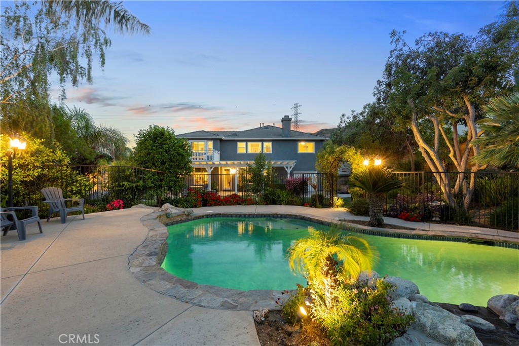 28834 Rock Canyon Drive Saugus, CA 91390 - Photo 58 of 58 a view of a swimming pool with a garden