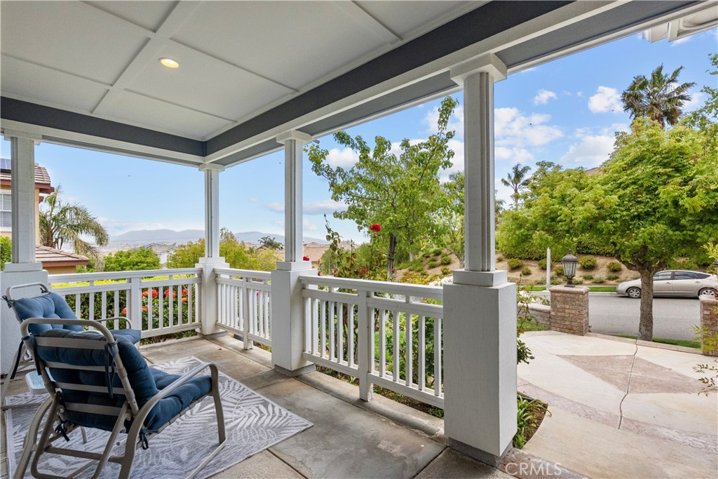 28834 Rock Canyon Drive Saugus, CA 91390 - Photo 9 of 58 a view of a chair and tables in the balcony