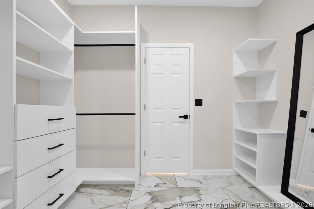 3025 Old Stage Road South Erwin, NC 28339 - Photo 26 of 50 a view of walk in closet with empty racks