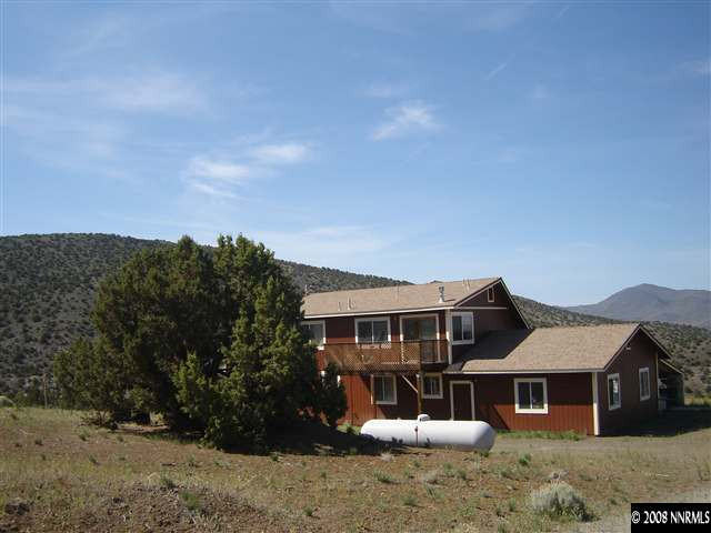 5700 Microwave Road Reno, NV 89510 - Photo 5 of 9 front view of a house with a yard