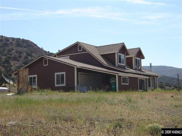 5700 Microwave Road Reno, NV 89510 - Photo 7 of 9 front view of house with a yard