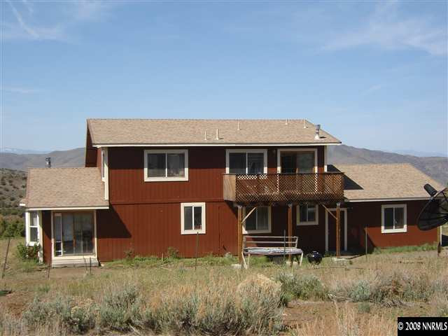 5700 Microwave Road Reno, NV 89510 - Photo 8 of 9 front view of a house with a yard