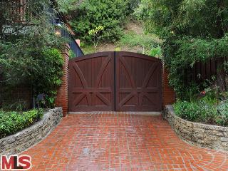 9531 Hidden Valley Road Beverly Hills, CA 90210 - Photo 1 of 1 a wooden bench sitting in front of a building