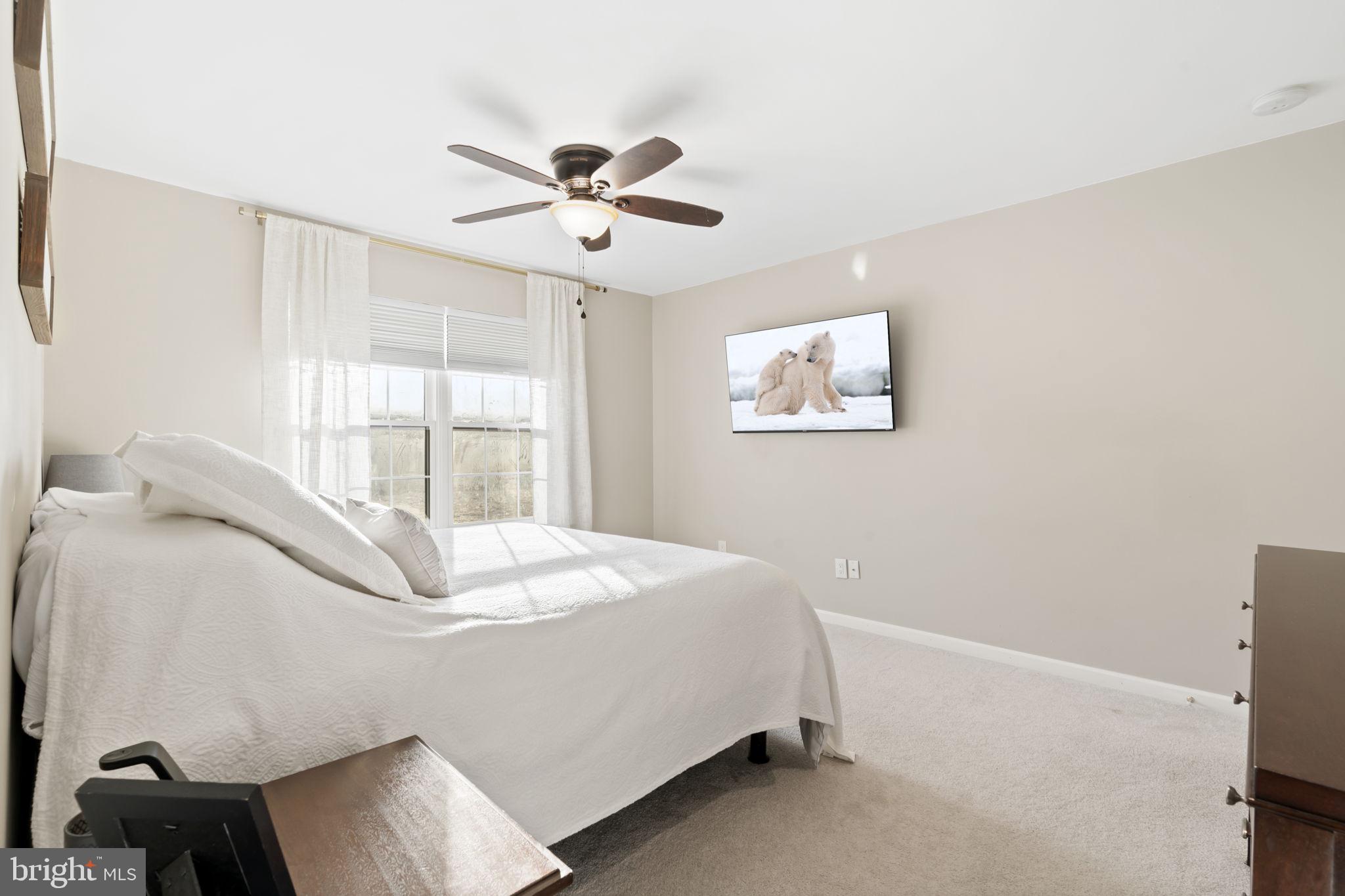 19 Chateau Circle, Unit 29 Chesterbrook, PA 19087 - Photo 22 of 40 a bedroom with a bed and a window