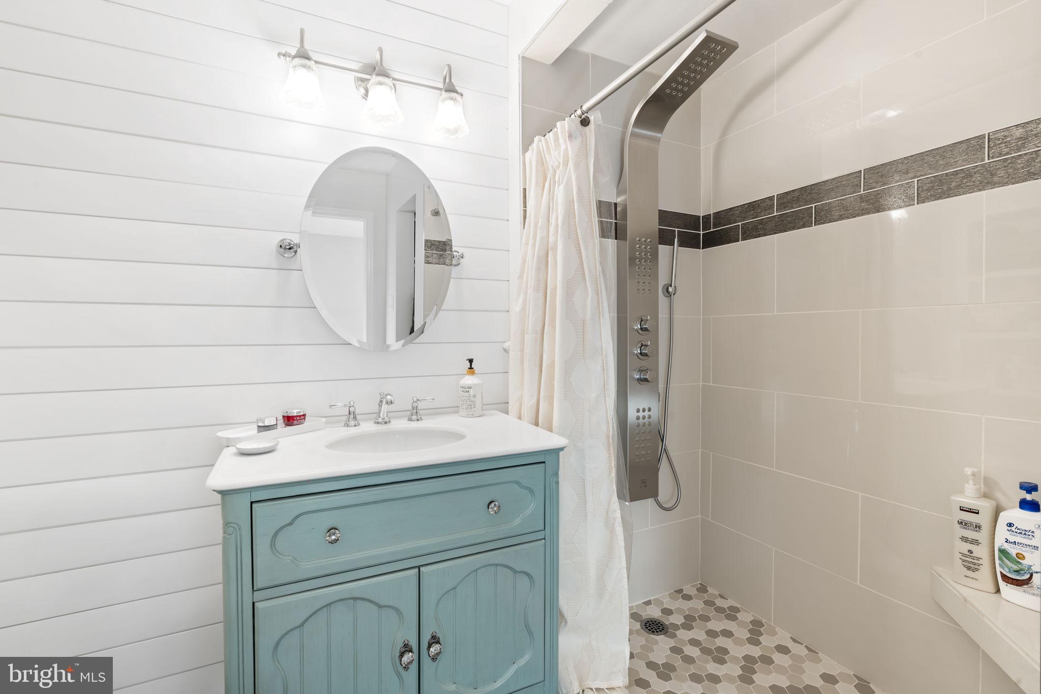 19 Chateau Circle, Unit 29 Chesterbrook, PA 19087 - Photo 24 of 40 a bathroom with a sink a toilet and shower