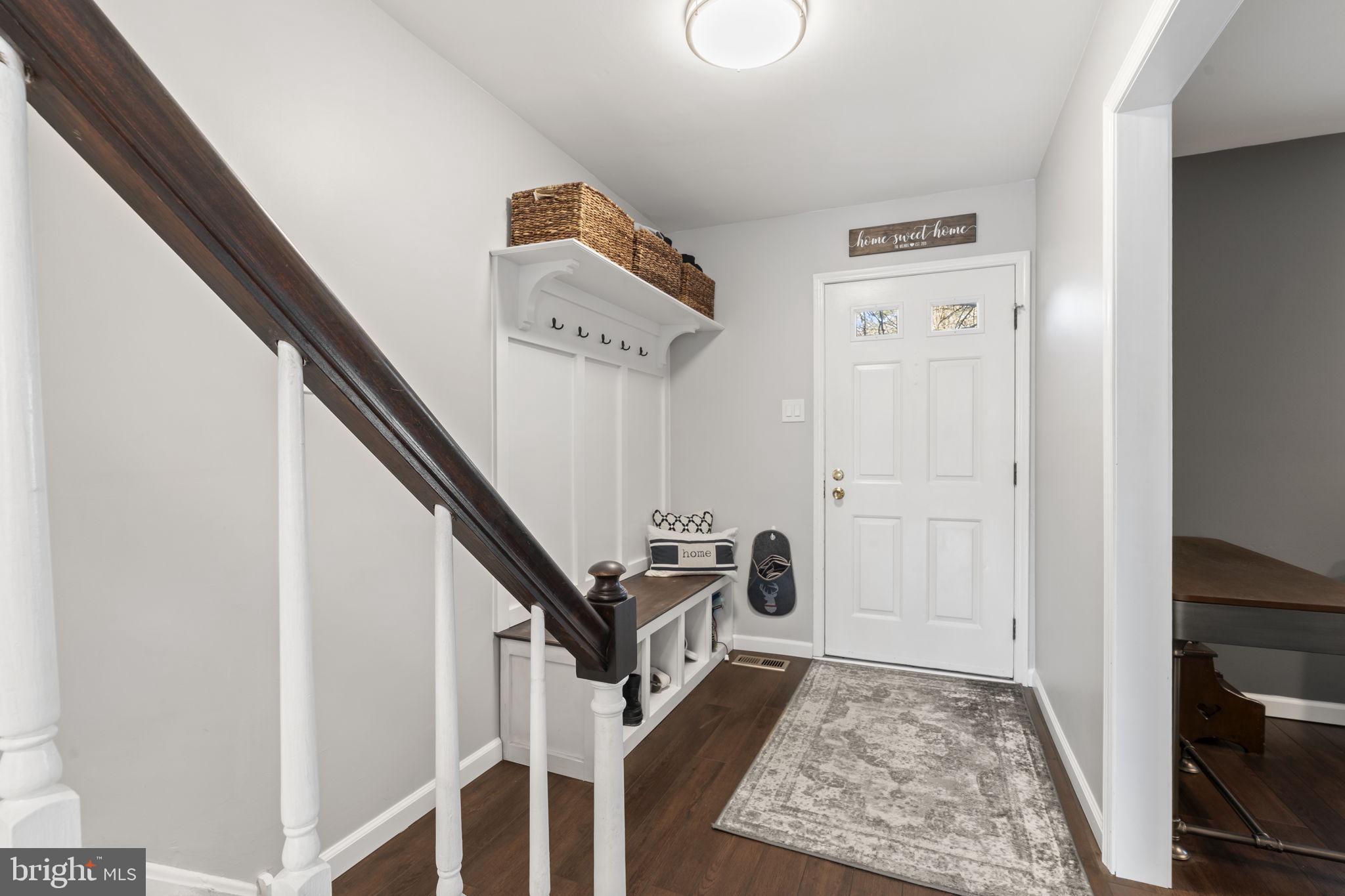 19 Chateau Circle, Unit 29 Chesterbrook, PA 19087 - Photo 4 of 40 a view of a hallway with wooden floor and staircase