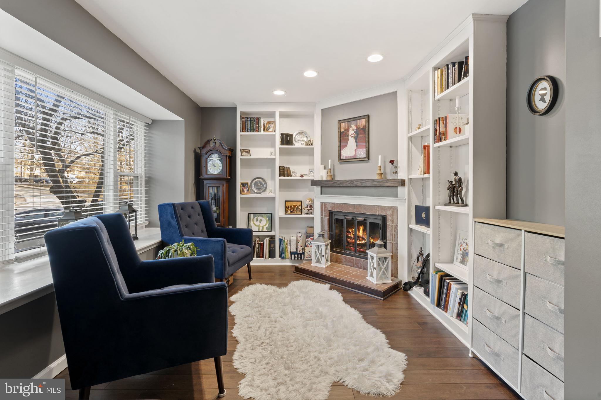 19 Chateau Circle, Unit 29 Chesterbrook, PA 19087 - Photo 5 of 40 a living room with furniture and a fireplace