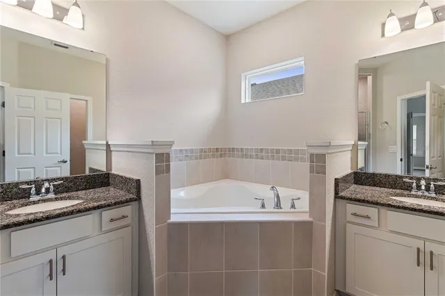 a bedroom with bed and a flat screen tv