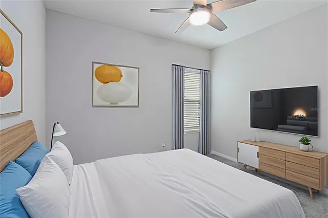 a bathroom with a granite countertop double vanity sink and a mirror