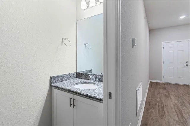 a bathroom with a bathtub and a sink
