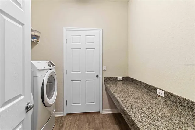 a aerial view of a house with swimming pool yard and outdoor seating