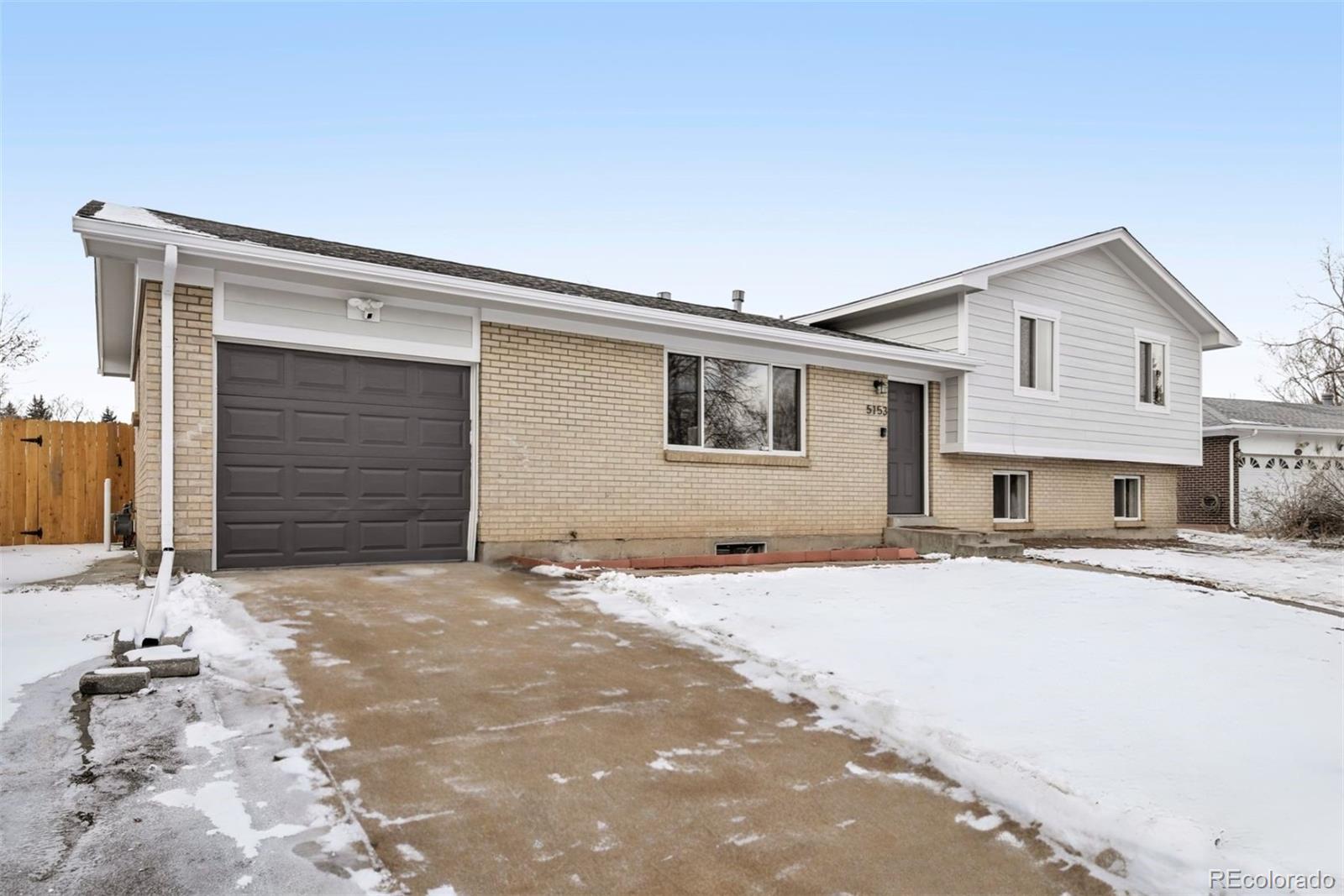 5153 Tucson Way Denver, CO 80239 - Photo 3 of 29 a house with a outdoor space