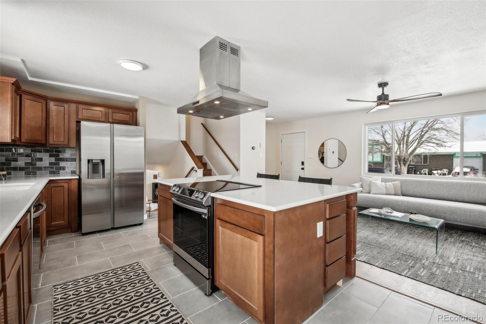 5153 Tucson Way Denver, CO 80239 - Photo 8 of 29 a kitchen with a stove and a refrigerator