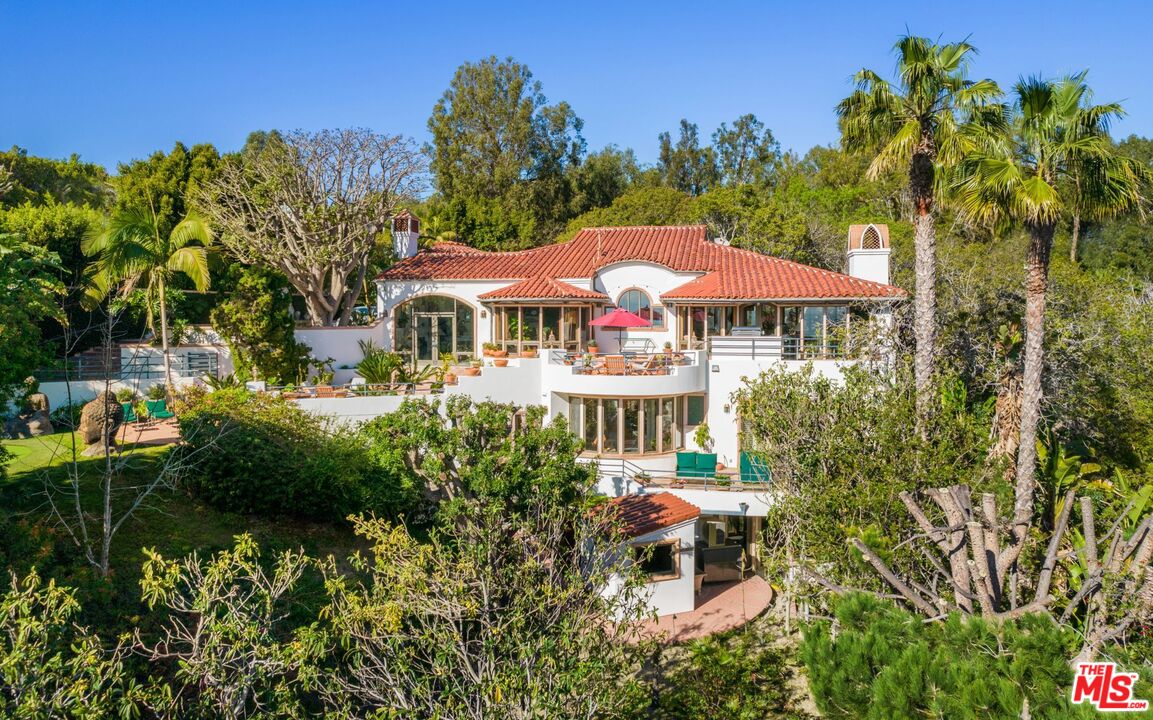27910 Pacific Coast Highway Malibu, CA 90265 - Photo 14 of 28 a view of a house with a yard and sitting area