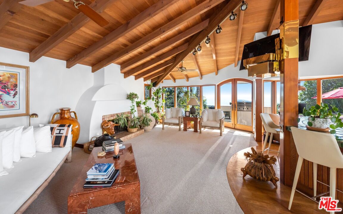 27910 Pacific Coast Highway Malibu, CA 90265 - Photo 23 of 28 a view of a patio with dining table and chairs