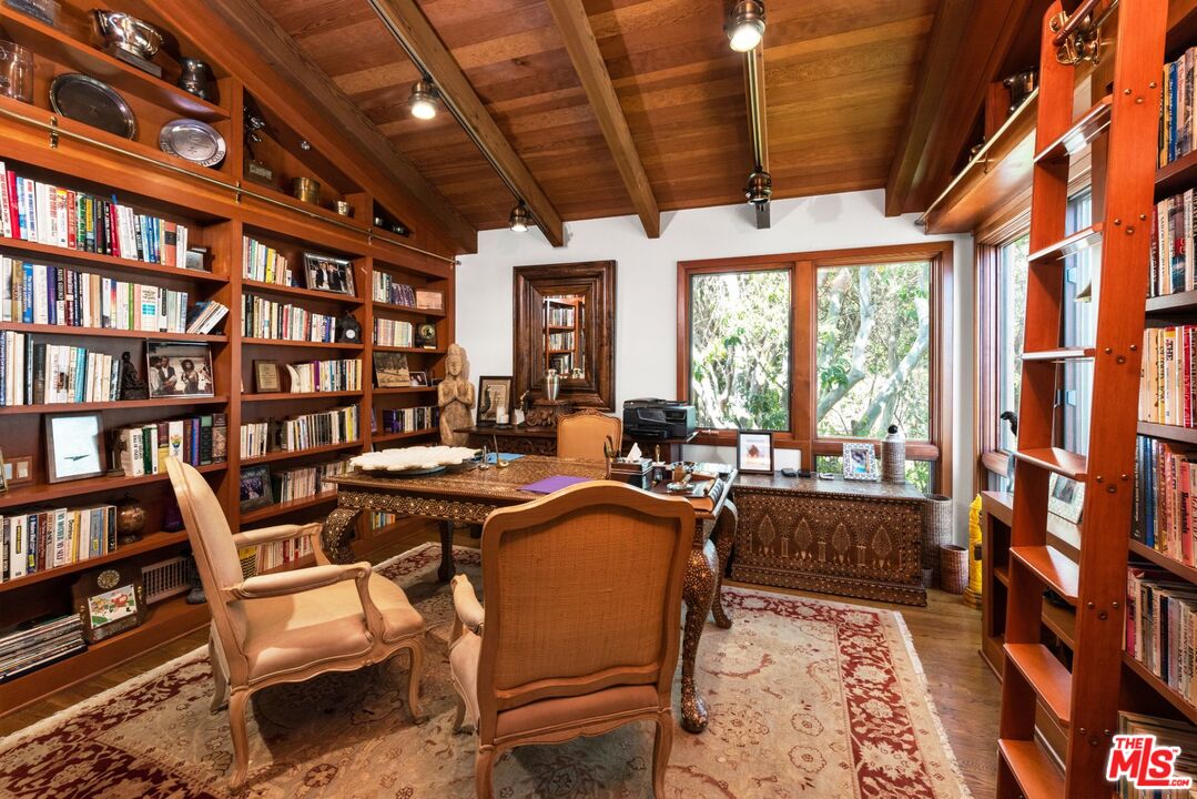 27910 Pacific Coast Highway Malibu, CA 90265 - Photo 24 of 28 a dining room with lots of furniture and a rug