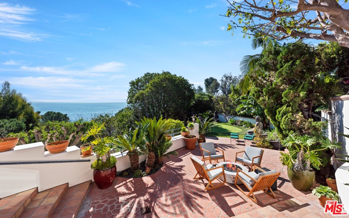 27910 Pacific Coast Highway Malibu, CA 90265 - Photo 28 of 28 a view of a yard with plants and a garden