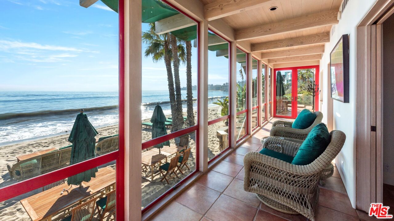 27910 Pacific Coast Highway Malibu, CA 90265 - Photo 10 of 28 a living room with furniture and a large window