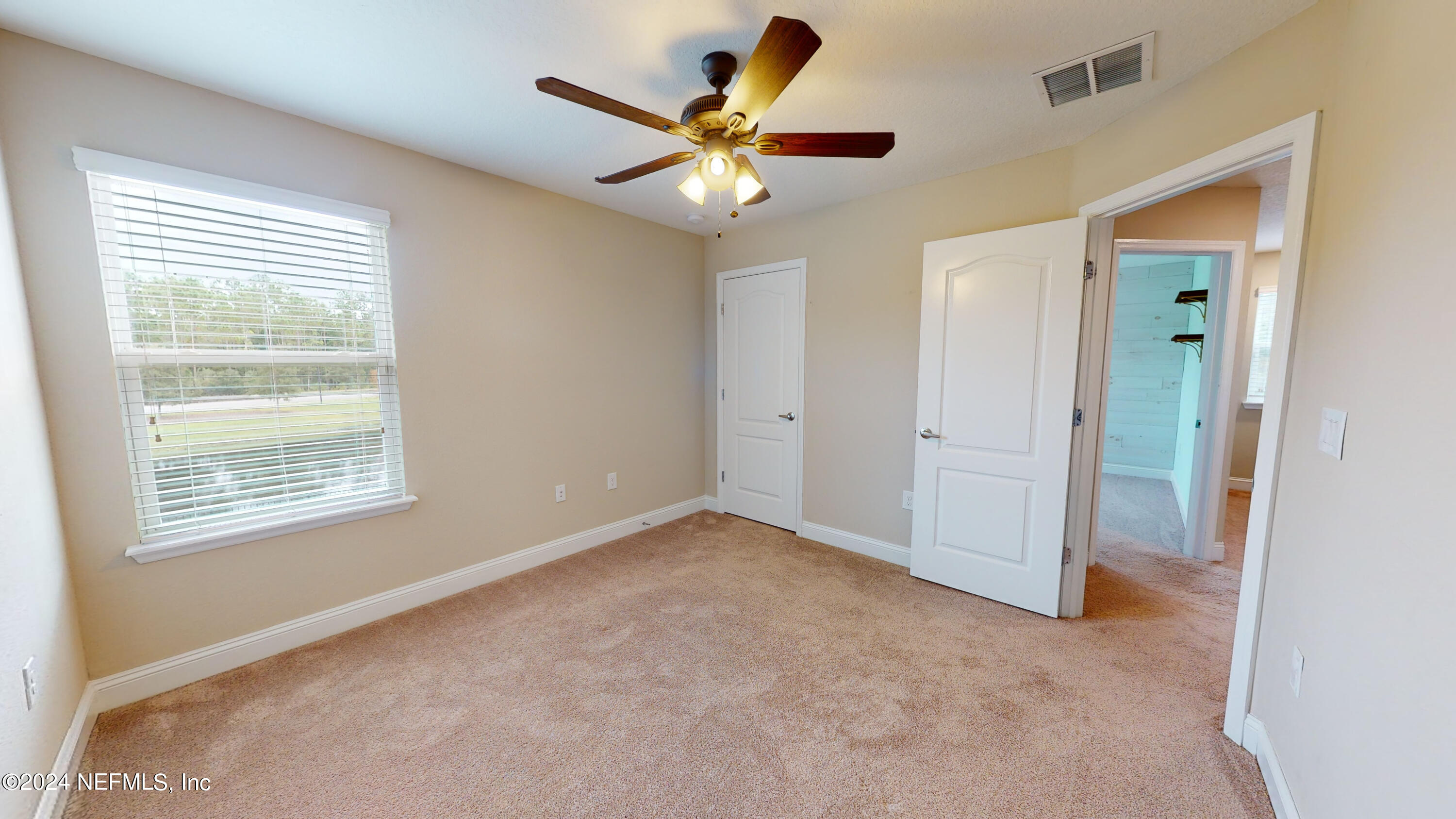 201 Silver Creek Place St. Augustine, FL 32095 - Photo 14 of 25 a view of an empty room with a window
